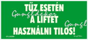 Utánvilágítós tábla, zöld háttér, tűz esetén a liftet használni tilos felirattal